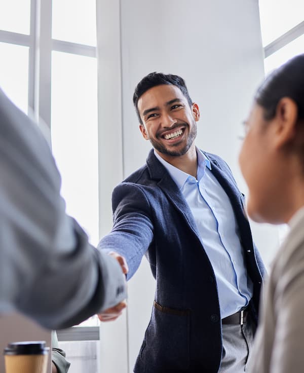 Handshake between two people, representing a new partnership with Telcoe Federal Credit Union.